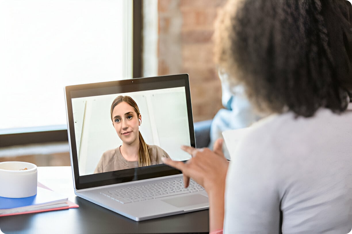 One-on-one virtual workplace coaching session with a professional coach guiding a high-achieving woman through personal growth and career strategies. One-on-one virtual workplace coaching session with a professional coach guiding a high-achieving woman through personal growth and career strategies.
